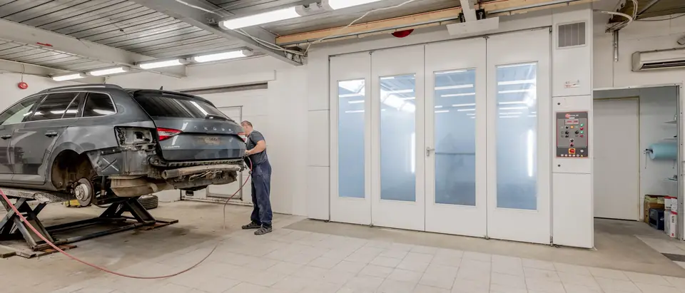 Clean service bay with a car on a lift
