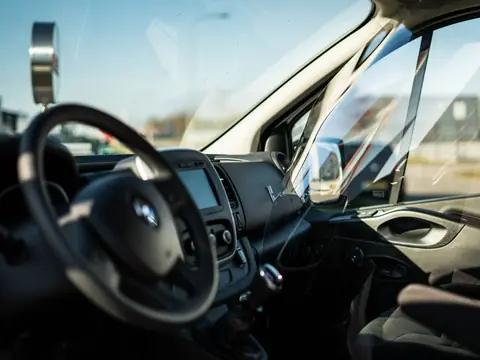 View from the driver seat through the windshield and side glass of a van