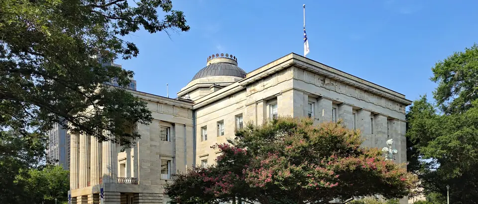 North Carolina State Capitol among trees in Raleigh